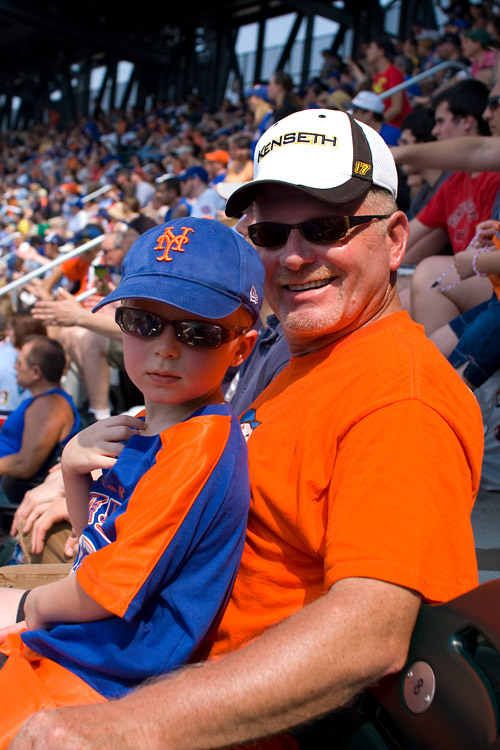 Enjoying a Mets win with Grandpa, despite the midday sun sapping Ivan's strength