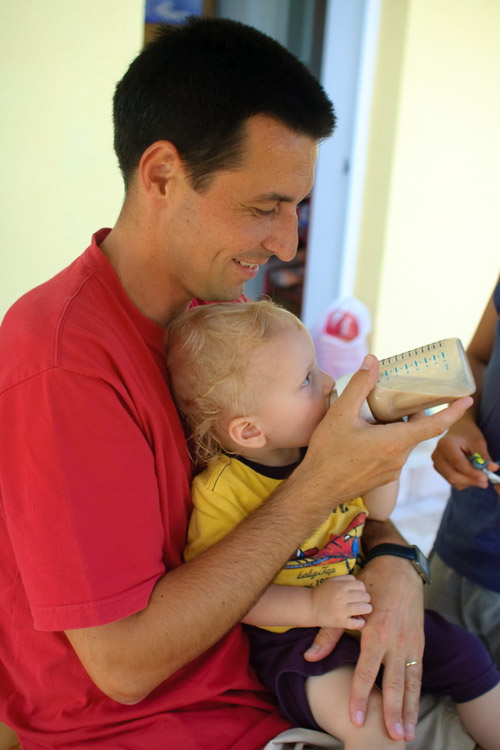 Nikola relaxes and takes a bottle (!) from Uncle Lacek, one of his new best friends