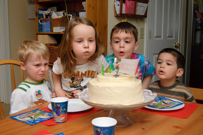 Ivan has a hard time letting his friends blow out the candles with him