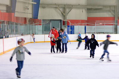 Mama and Veronika help Ivan with his first time ice skating