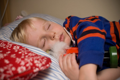 Asleep with his beloved (wooden) nutcracker in his arms