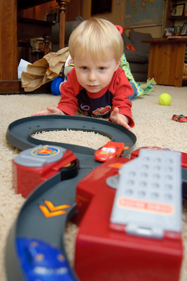 Watching intently as Lightning McQueen chases Doc Hudson around the figure eight