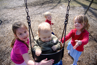 Nikola gets some enthusiastic help on the swing