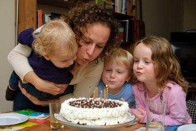 Helping Mama with the candles on her birthday cake