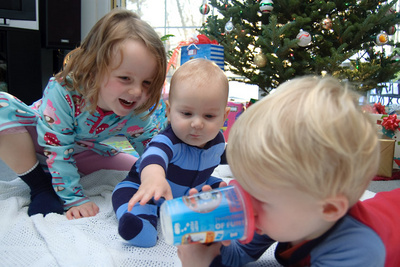 Powering up with a cup of milk to prepare for the hundreds of Christmas presents from Grandma and Grandpa that need opening