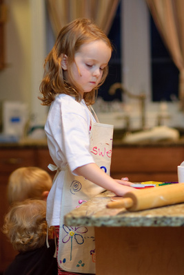 Preparing herself and her workspace for making Christmas cookies