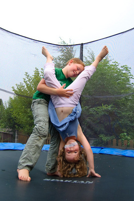 Veronika gets a little help on her handstand from her cousin Lukas