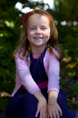 Modeling her Sunday best, in blues and pinks