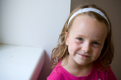 That's the look of a girl that's just seen what her new bedroom (without brothers!) looks like