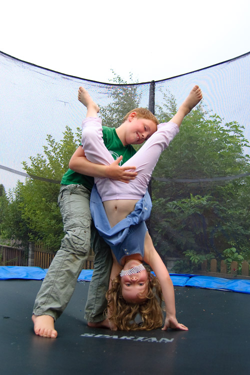 Veronika gets a little help on her handstand from her cousin Lukas