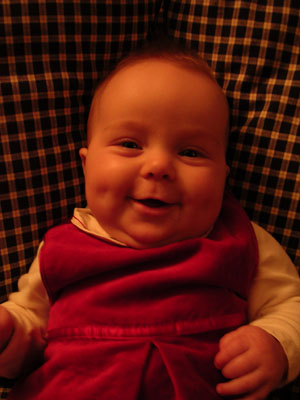 Looking adorable in her velvet Christmas outfit