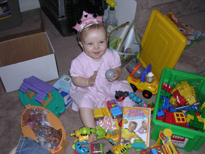 The birthday girl surrounded by some (not all, mind you) of her new toys