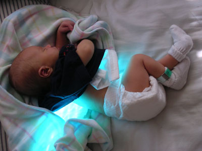 Curled up in our bed, aglow