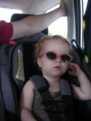 In the backseat, choosing instead to be chauffeured